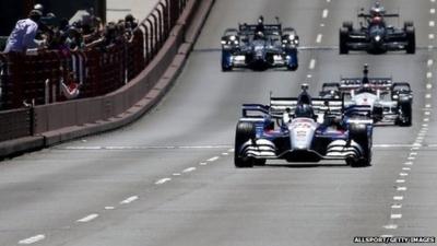 IndyCar driver Marco Andretti, driving Justin Wilson's No 25 car, leads a motorcade in honour of Wilson over the Golden Gate Bridge