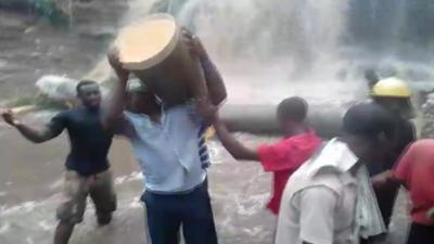 Man carrying a log