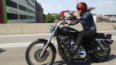 A woman motorcyclist