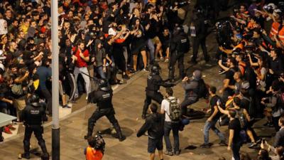 Police and protesters at El Prat Airport