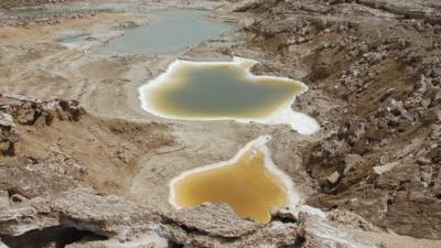 An image taken by a BBC drone above a series of sinkholes that appeared as the Dead Sea retreated