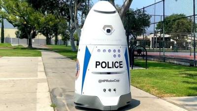 Robocop patrolling a park in LA