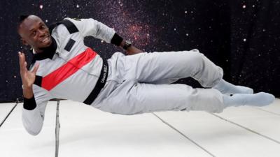 Usain Bolt lying down while floating in zero gravity