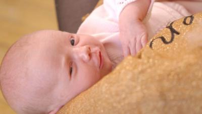 Baby Penelope being cared for by her mother