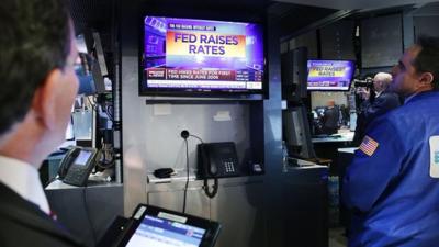 Financial traders respond to Fed's first rate hike since 2006