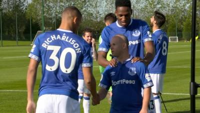 Danny shakes the hand of Everton players