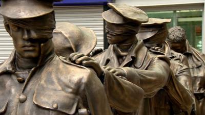 Blind veteran statue at Manchester Piccadilly Station.