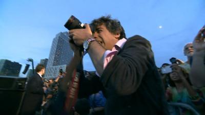 Arun Chaudhary photographing a Sanders event in NYC