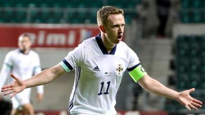 Shane Ferguson celebrates scoring against Lithuania