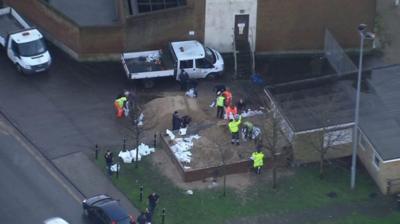 Filling sandbags in Great Yamouth