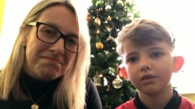 Seven-year-old Teddy Stewart tells Victoria Derbyshire of his sadness at having to cancel a trip to Lapland to Father Christmas.