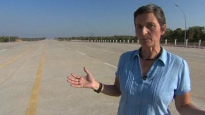 The BBC's Rachel Harvey walks an empty highway in Burma's capital city