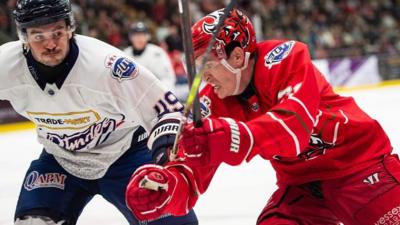 Cardiff Devils’ Ryan Barrow battles with Dundee Stars’ Xavier Pouliot in the Elite League Playoff quarterfinal first leg