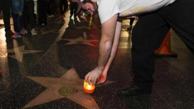 Fans tend Debbie Reynold's star on Walk of Fame