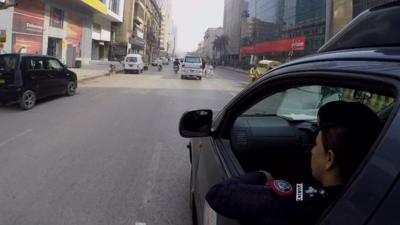 Syeda Ghazala in a police car