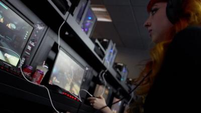 A woman playing a video game