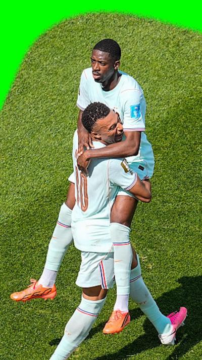 Ousmane Dembele and Kylian Mbappe celebrate