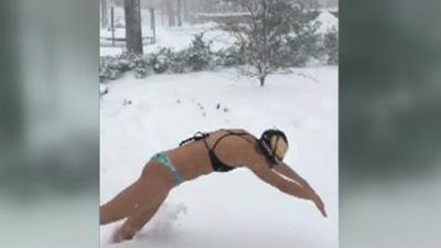 Woman diving into snow