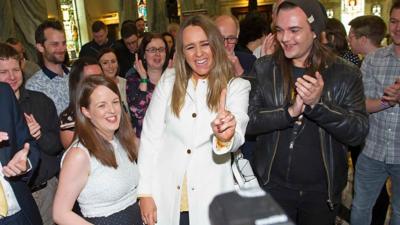 Alliance Party members celebrate at Belfast City Hall