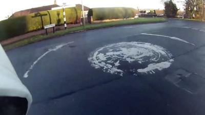 Footage showing a series of near misses on a roundabout has been released by a cyclist.