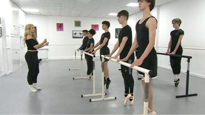 Boys doing ballet at a bar