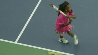 girl playing tennis