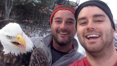 Neil and his brother Michael took a photo with the eagle before setting it free
