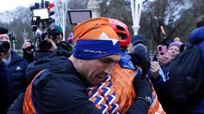 Kevin Sinfield hugging a person