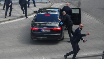 Security officers bundle prime minister into car