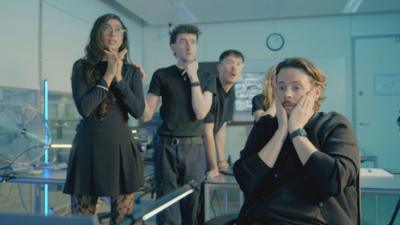 The Scam Interceptor team look tense in the control room.