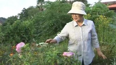 Naraha resident in garden