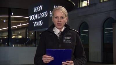 Police officer reading a statement