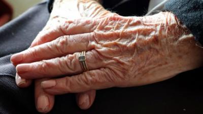 Hands of an elderly woman