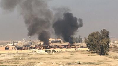 Smoke billows over Mosul airport, 23 February