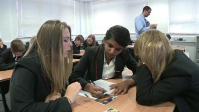 Pupils and teacher in classroom