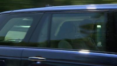 Harry and Meghan drive past