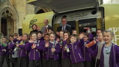 A group of kids with Michael Gove