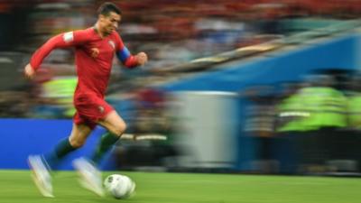 Cristiano Ronaldo running with football