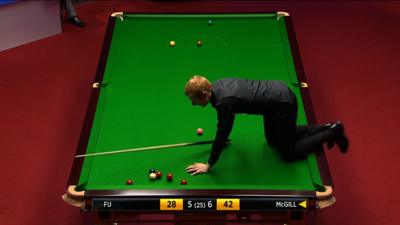 Anthony McGill climbing on table