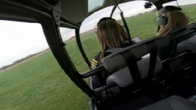 Captain Sarah Bowen flying with student Khadijah