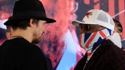 Usyk and Chisora stare down