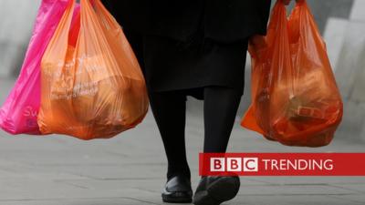 Woman holding plastic bags