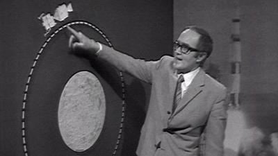 James Burke and a big board showing the distance between Apollo 10 and the Moon