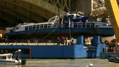 Boat lifted on to barge