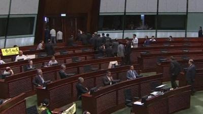 Lawmakers walk out of parliament in Hong Kong