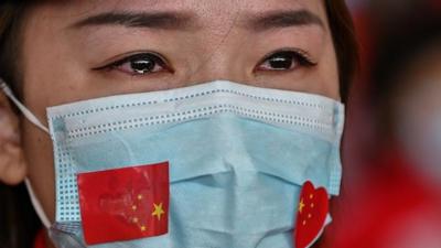 Teary-eyed woman in China