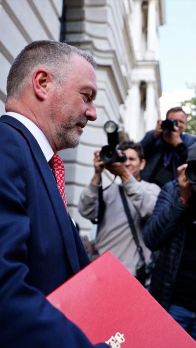 Reed speaking to reporters outside No10