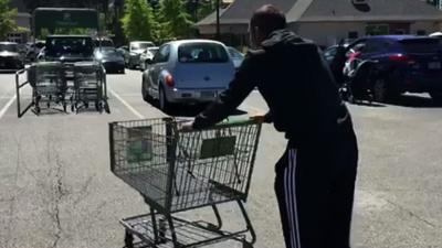 Golfer Sergio Garcia with a shopping trolley