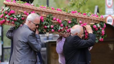 Saffie Roussos' coffin being carried into church