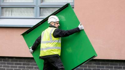 Cladding is removed from a tower block in Sheffield